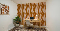 Study room accent wall styled with two-tone wavy stripe wallpaper in earthy tones