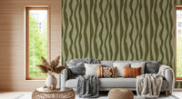 Mid century inspired olive green wavy stripe wallpaper with wide curving bands.