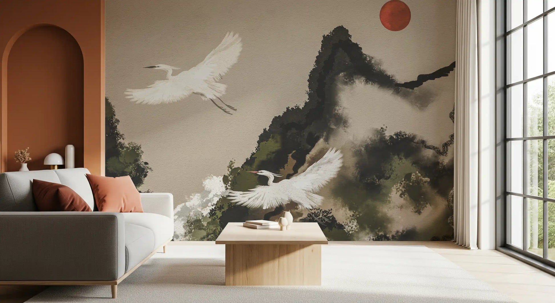 Sumi ink wash mural with two white cranes flying past misty dark mountains and a red sun.
