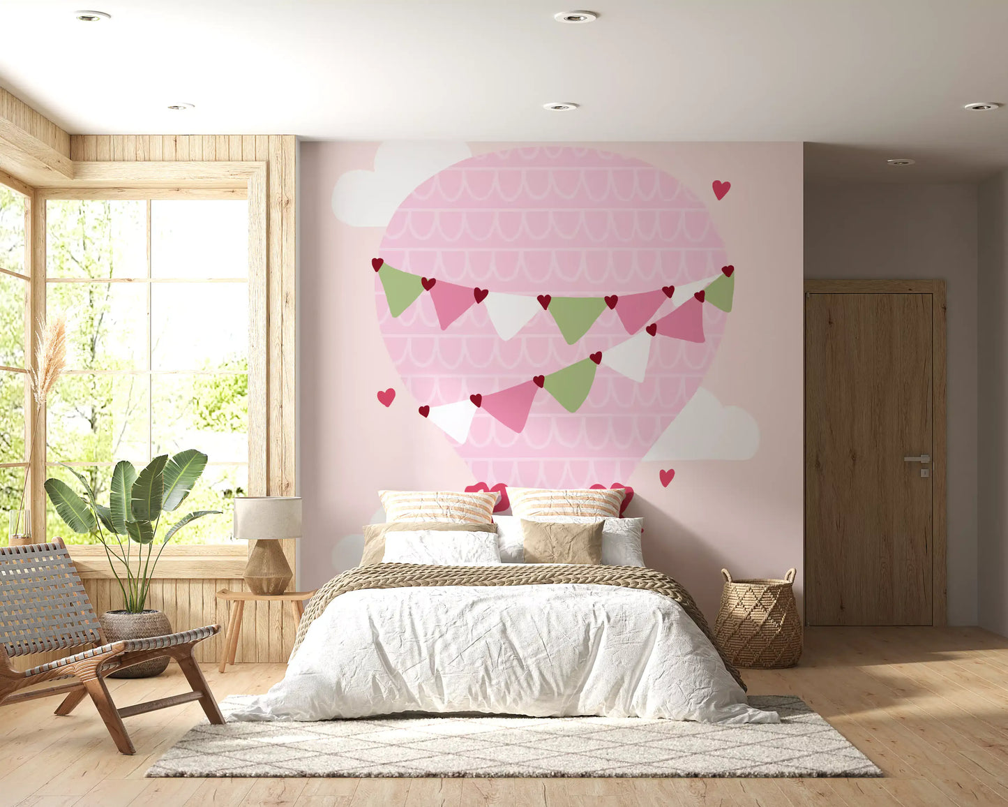 Pink hot air balloon wall mural with scalloped pattern and bunting flags in bedroom.