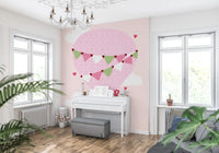 Dreamy pink sky mural with white clouds and tiny heart shapes.