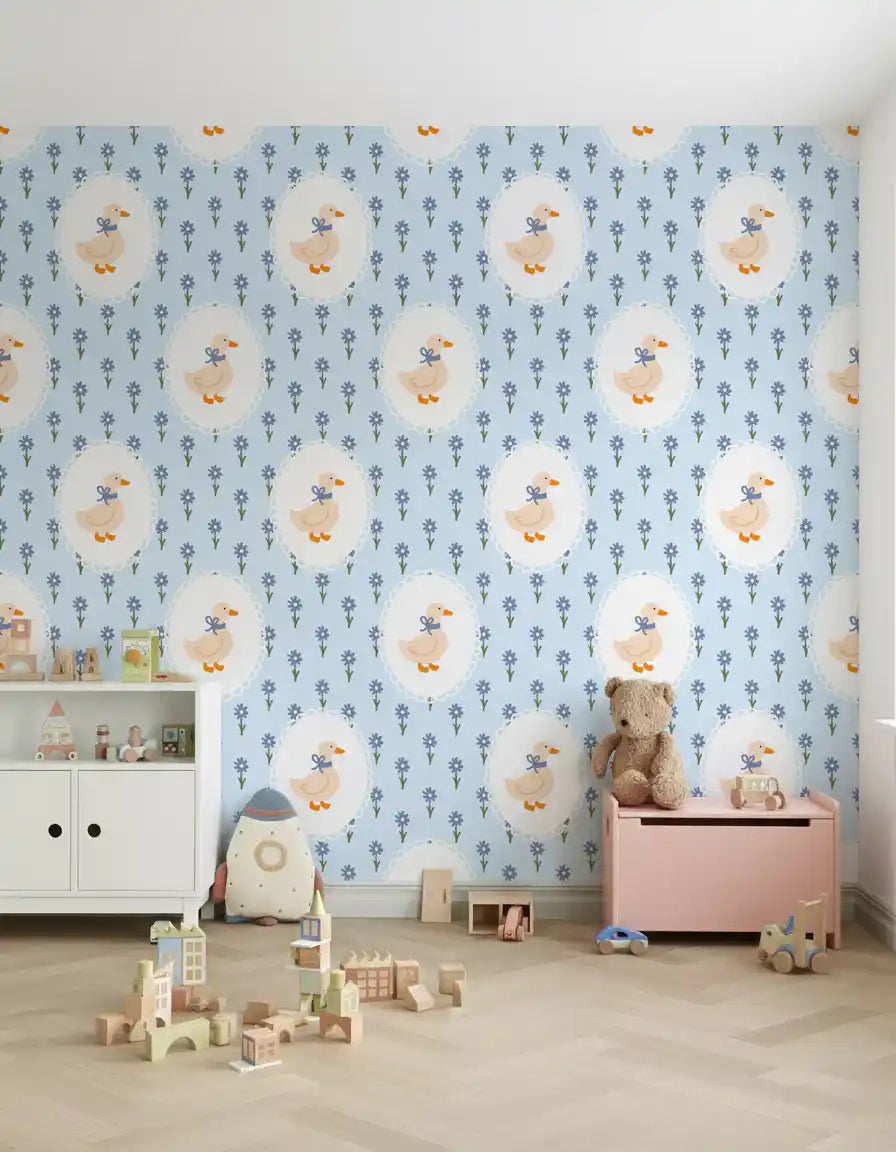 Cream and blue cottage goose pattern wallpaper on a kids room feature wall.