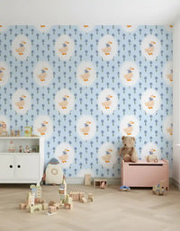 Cream and blue cottage goose pattern wallpaper on a kids room feature wall.
