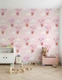Kids room wallpaper showing bears floating in patterned hot air balloons.