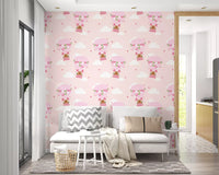 Pink and green bear balloon pattern wallpaper with white fluffy clouds.