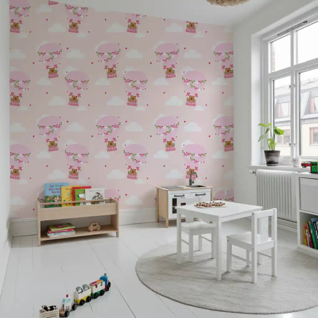 Nursery wallpaper with bear balloon motif in pastel pink tones.