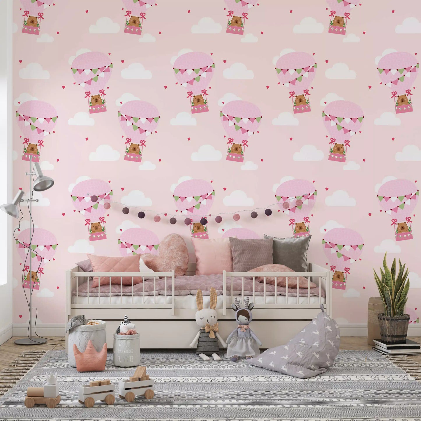 Toddler bedroom wallpaper with pink balloons carrying small brown cartoon bears.