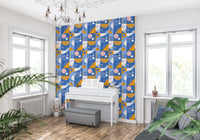 Abstract geometric wallpaper in marigold orange and cobalt blue with pink dot accents.