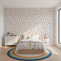 Child's bedroom feature wall with whimsical woodland storybook pattern wallpaper.