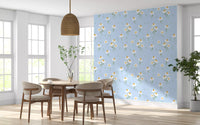 Open dining room wall with daisy wallpaper with white floral print.