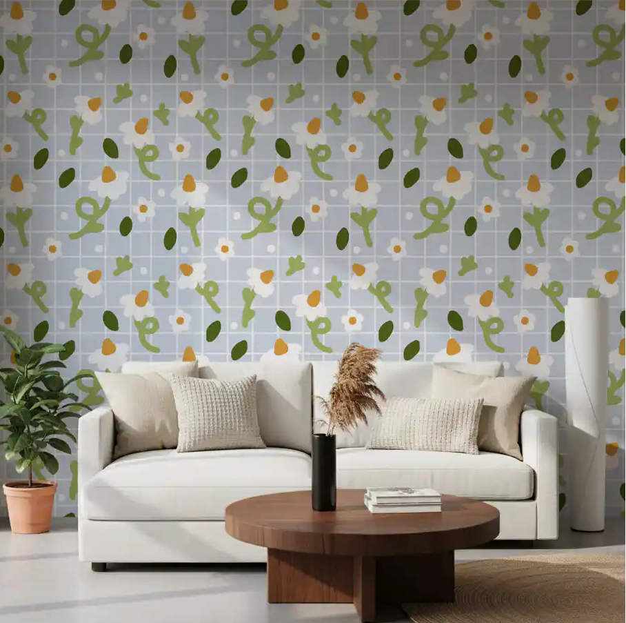 Daisy and blue grid wallpaper styled across a Scandinavian-inspired living room wall.
