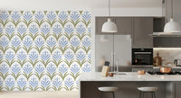 Repeat floral wallpaper with green and blue tones on a dining area wall. 
