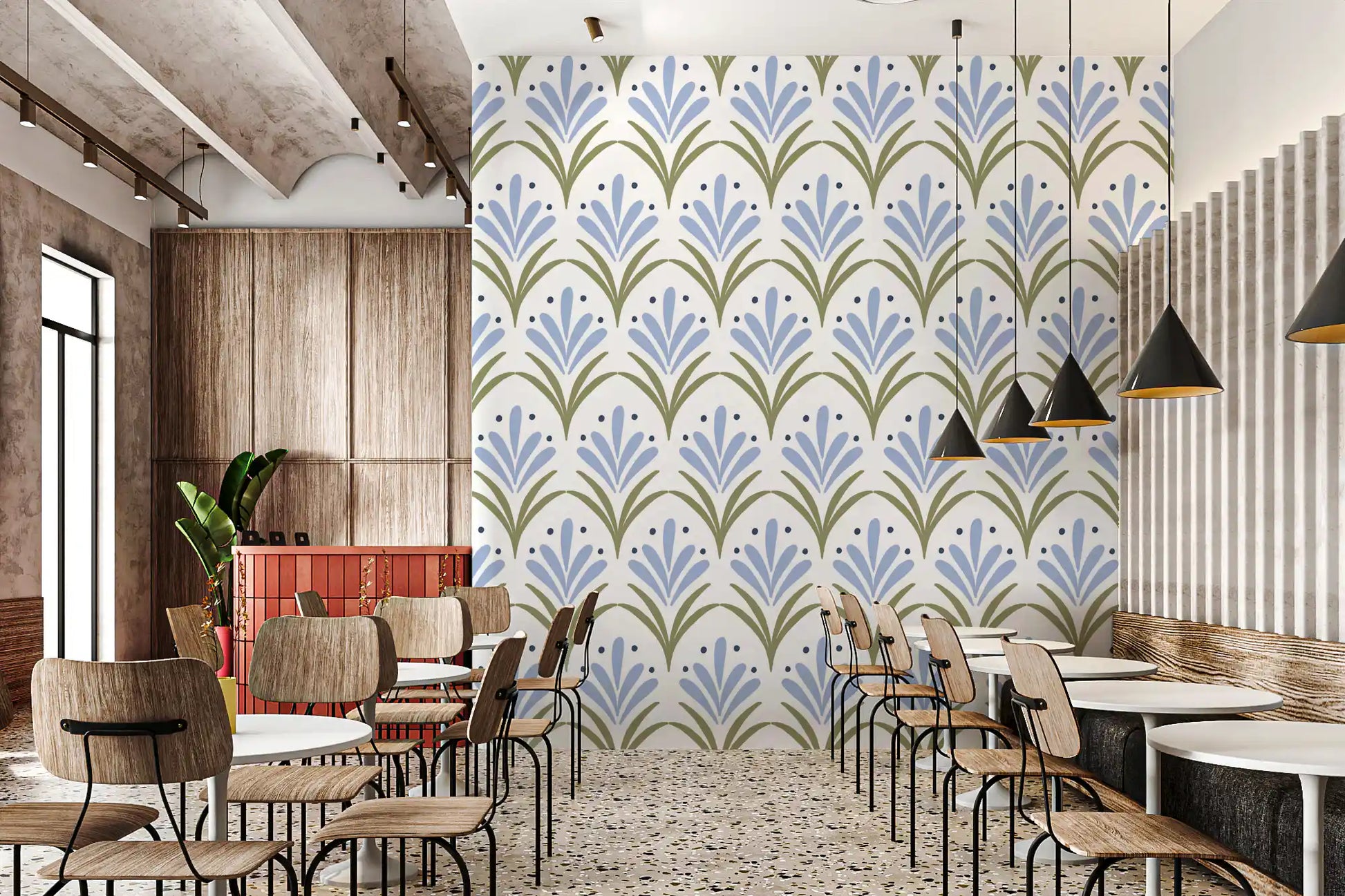 Art Deco floral wallpaper with powder blue and sage tones in cafe interior.