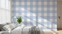 Pale blue check wallpaper with soft white and cornflower blue squares.