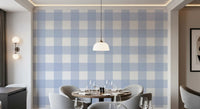 Dining room styled with calm blue and white checkered wallpaper.