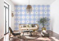 Soft floral gingham wallpaper covering a hallway interior.