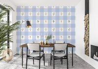 Gingham wallpaper pattern with olive stems and bell-shaped lilac flower clusters.