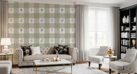 Sage green and white gingham check wallpaper with scattered floral motifs in coral blue yellow and lavender.