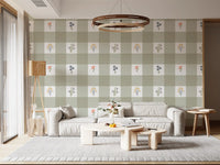 Soft sage gingham wallpaper with yellow daisy and lavender bell flower motifs scattered across white square.