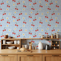 Illustrated cherry and heart repeat wallpaper with powder blue gingham background.