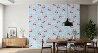 Dining room accent wall featuring blue gingham cherry and daisy repeat wallpaper.