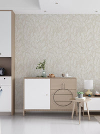 Continuous outline floral pattern in white on warm beige wallpaper. 