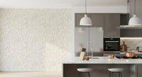 Flowing stem and leaf line art pattern on a beige floral wallpaper in kitchen.