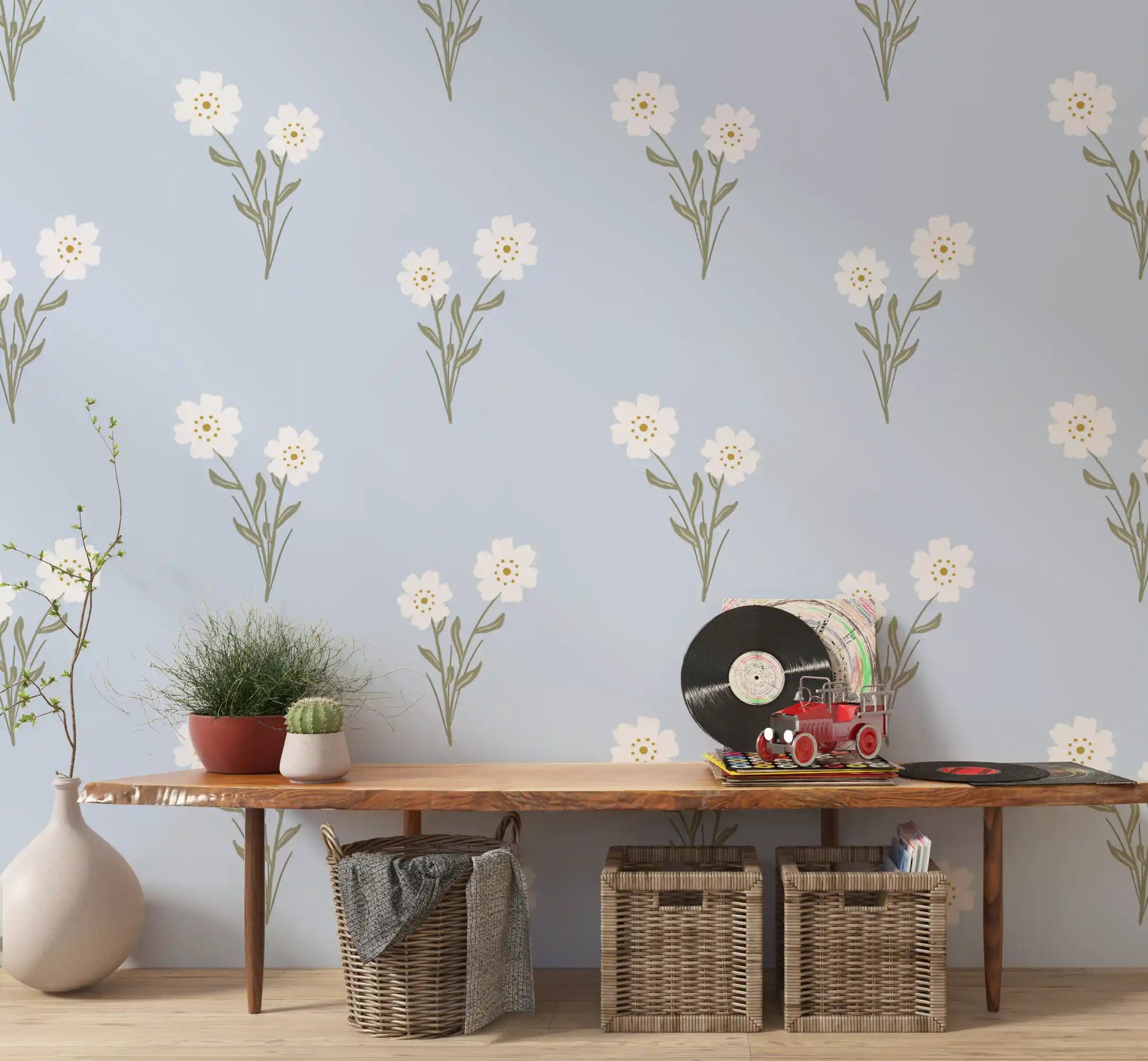 Hallway wall with airy pastel bloom botanical wallpaper in rose and cream tones.