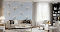 Living area wall with soft bloom serenity floral wallpaper in pastel rose and cream tone.