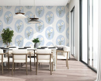 Scalloped floral wallpaper pattern with white daisy blooms and powder blue oval frames.