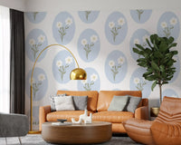 White and blue botanical floral wallpaper with scalloped oval frame repeat pattern.