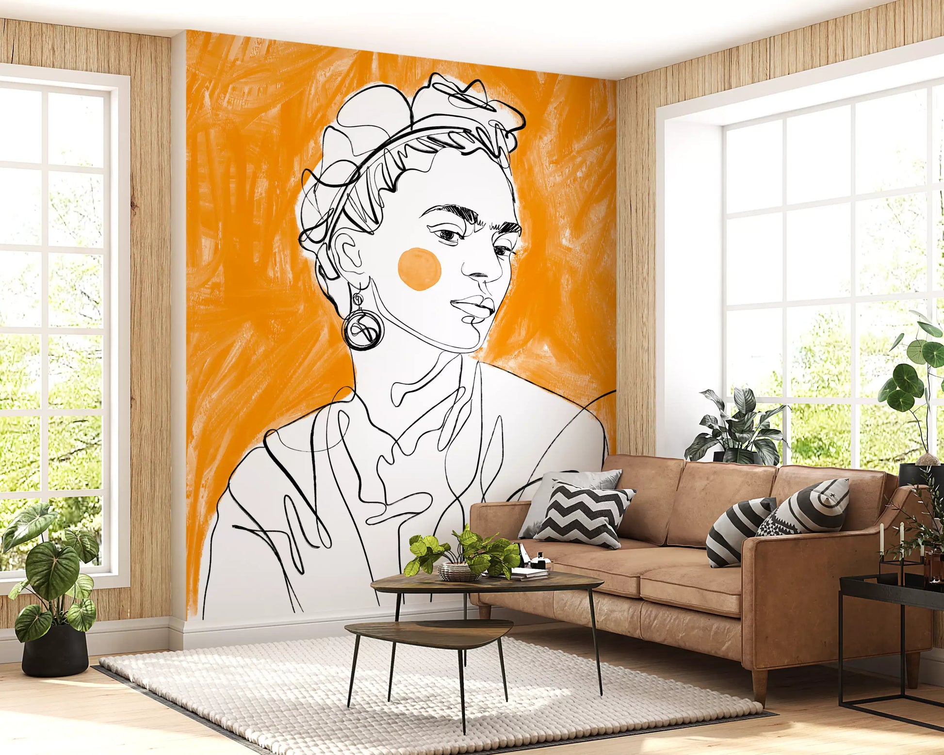Black line art portrait with circular orange accent on tangerine brushstroke mural in living room.
