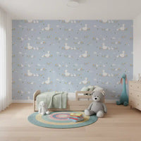 Pastel duckling wallpaper styled across a toddler room.