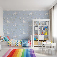 Baby ducklings wallpaper with yellow flowers on sky blue background.