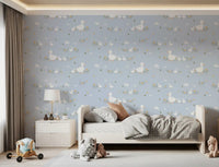 Pastel blue wallpaper with white ducklings and soft cloud accents.