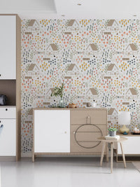 Floral cottage wallpaper printed with daisies, hens, and small herb stems in hallway.