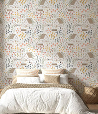 Country cottage wallpaper with tiny thatched houses, flower, and roaming hens in bedroom.