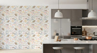 Whimsical kids wallpaper showing cottages, picket fences, tulips, and meadow sprigs.