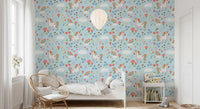 Kids bedroom feature wall in unicorn wallpaper with mushrooms and rainbows.