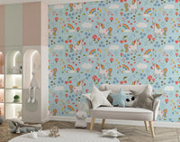 Nursery wall with unicorn wallpaper, pastel rainbows, and soft cloud motifs.