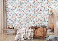 Storybook style wallpaper featuring unicorns, rainbows and floral accents in toddler room.