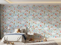 Unicorn wallpaper installed in a bedroom with chequered pattern and rainbow accents.