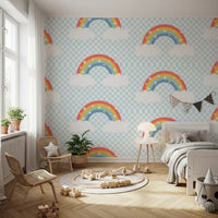 Small white stars sprinkled wallpaper with pastel rainbow bands and clouds.