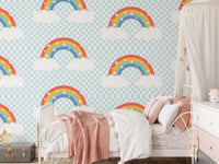 Toddler bedroom wall with pastel rainbow and starry sky wallpaper