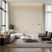 Minimalist beige wallpaper with random cream brushstrokes in living area.