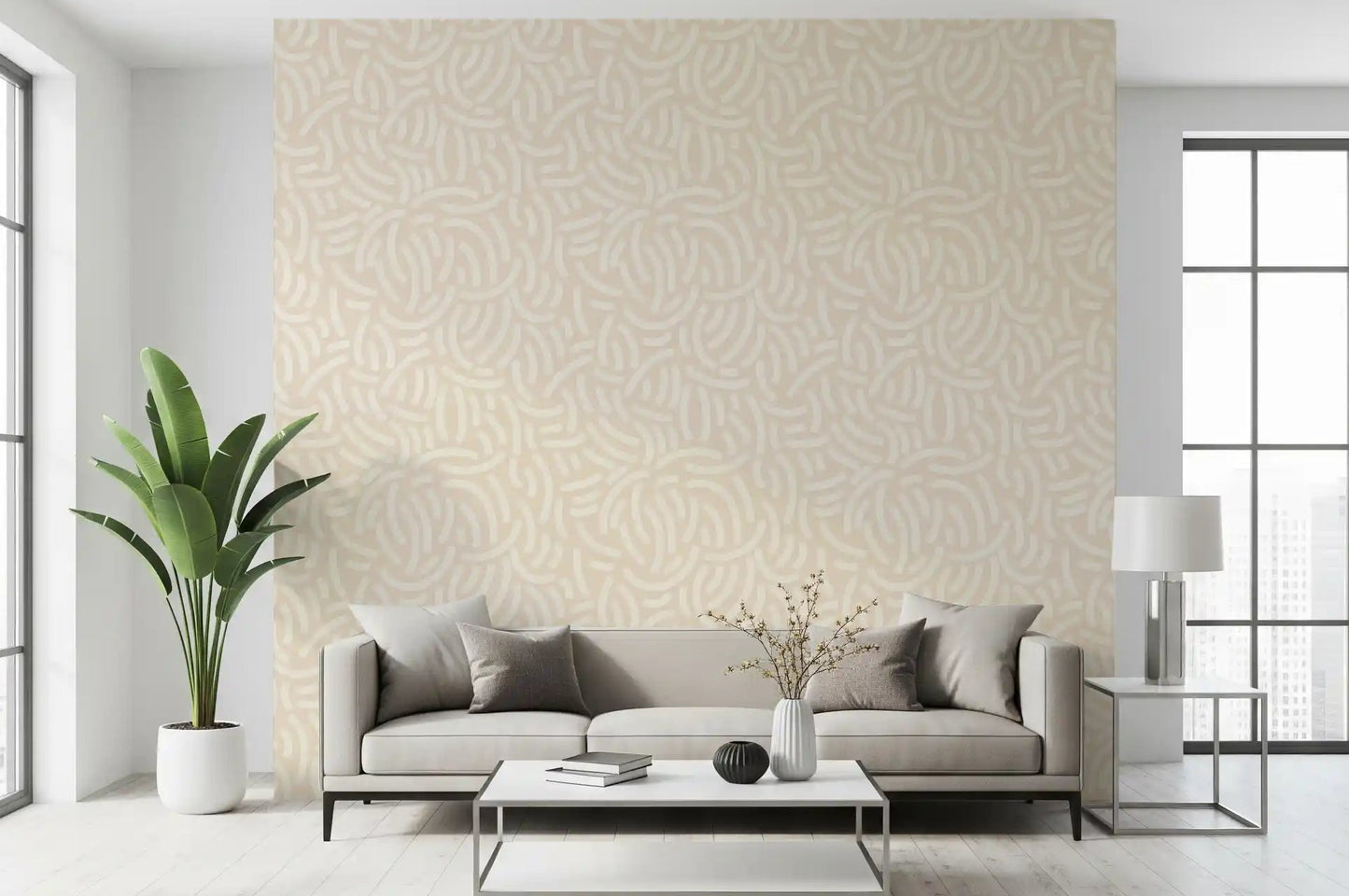 Beige wallpaper with cream brushstroke arcs scattered across a soft painted base. 