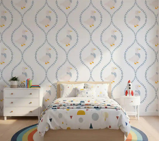 White ducks wallpaper with blue polka dot bows in children's bedroom.