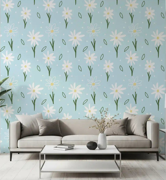 White daisies with yellow centres on a soft blue wallpaper in living room.