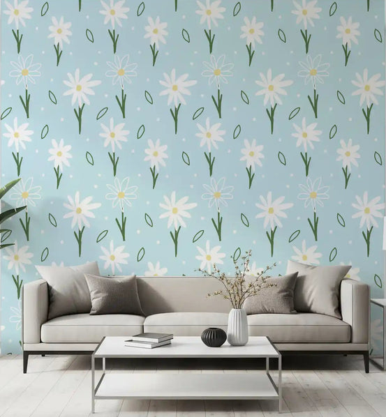 White daisies with yellow centres on a soft blue wallpaper in living room., GD10104