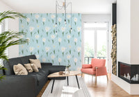 Scandinavian daisy wallpaper in white, yellow, and green on a soft sky-blue tone.